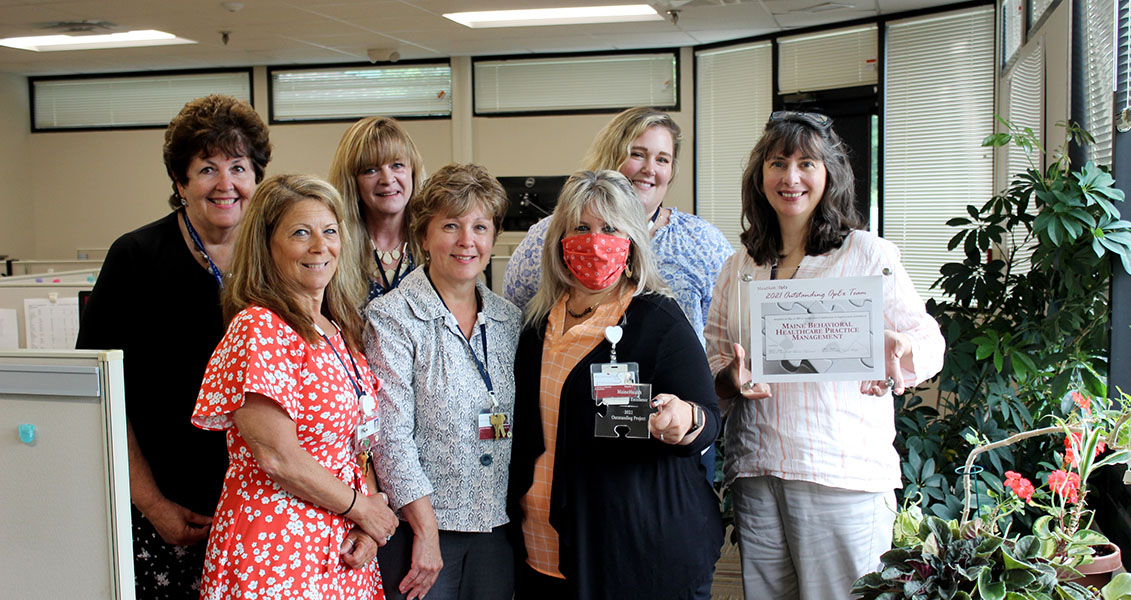 Practice management team with their recent award